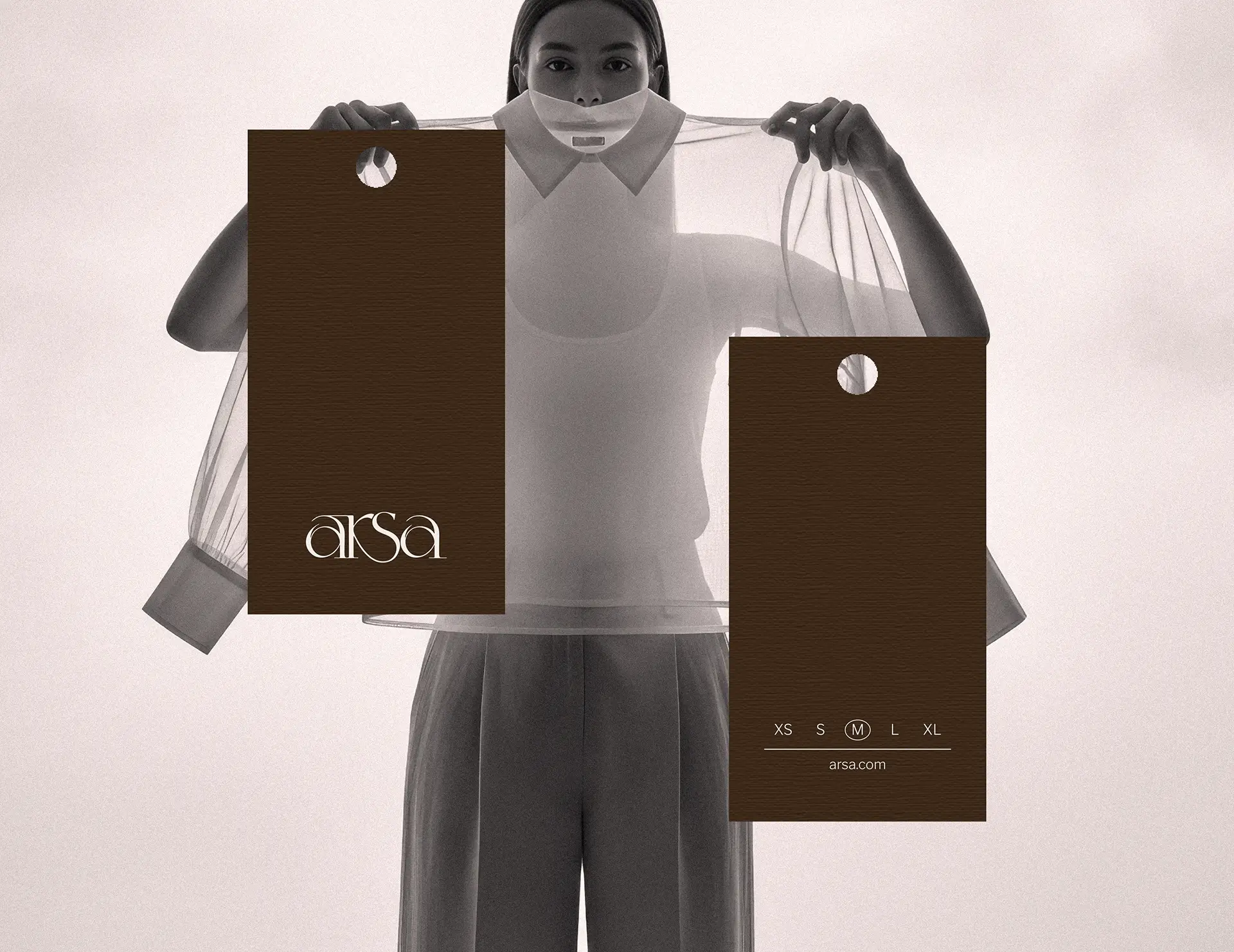 Garment tag and brand collateral design for Arsa premium clothing label showing logo and typography system